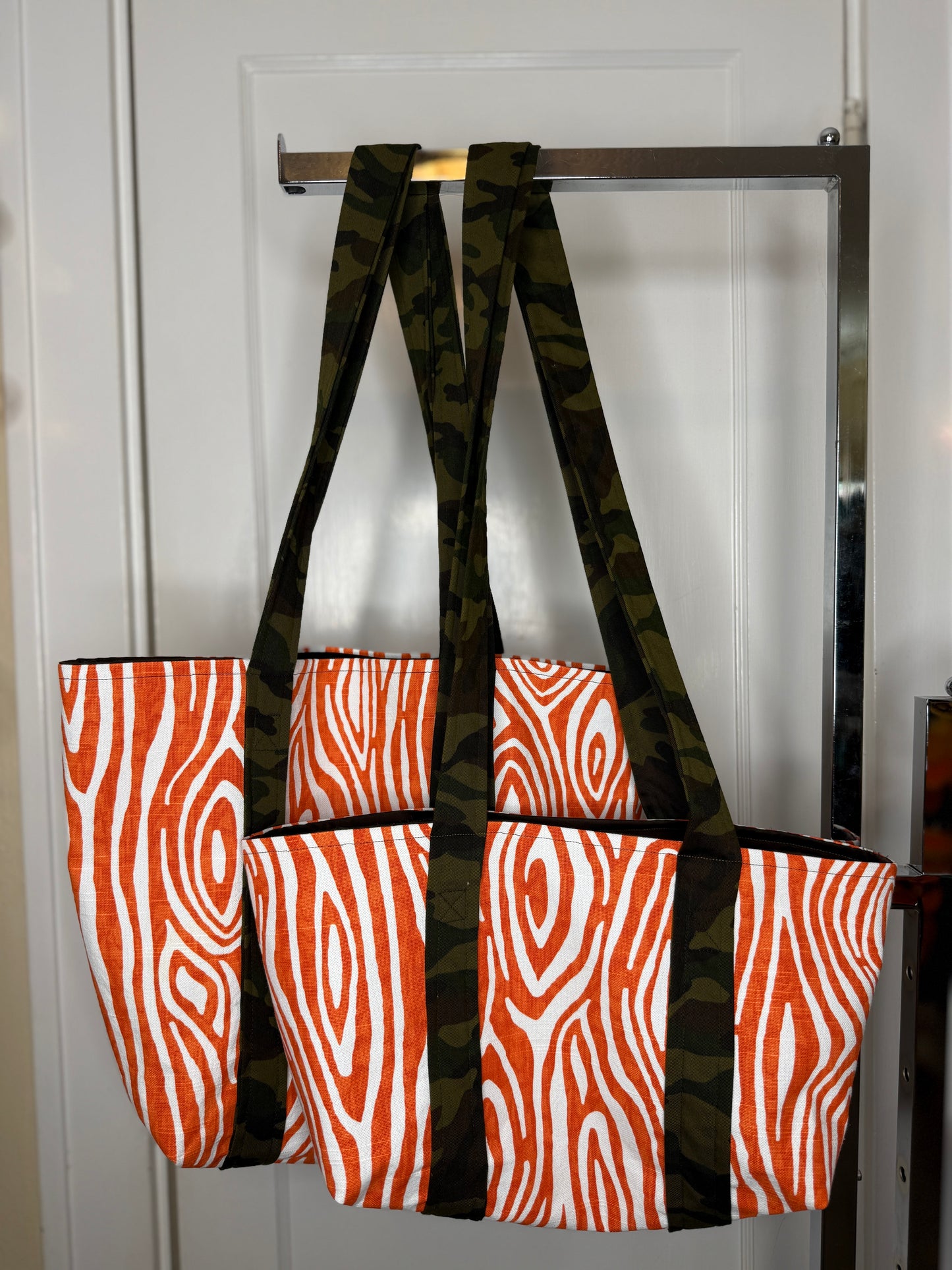 The mini tote next to the regular tote