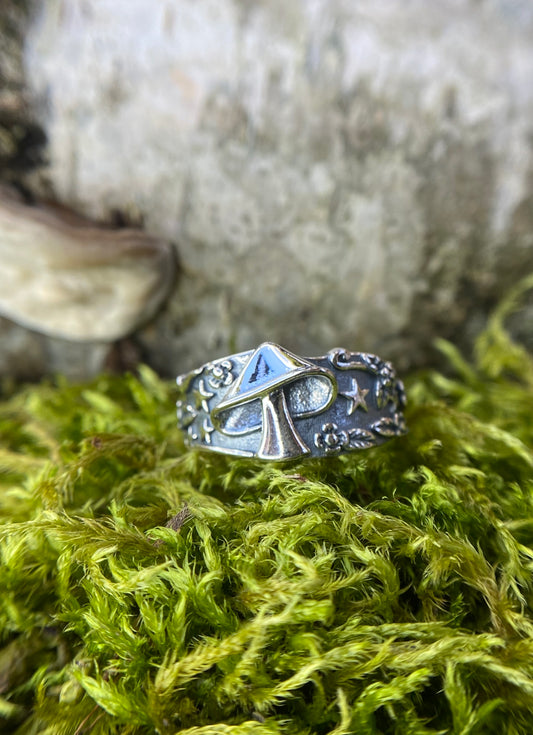 Sterling silver mushroom ring with stars and flowers.