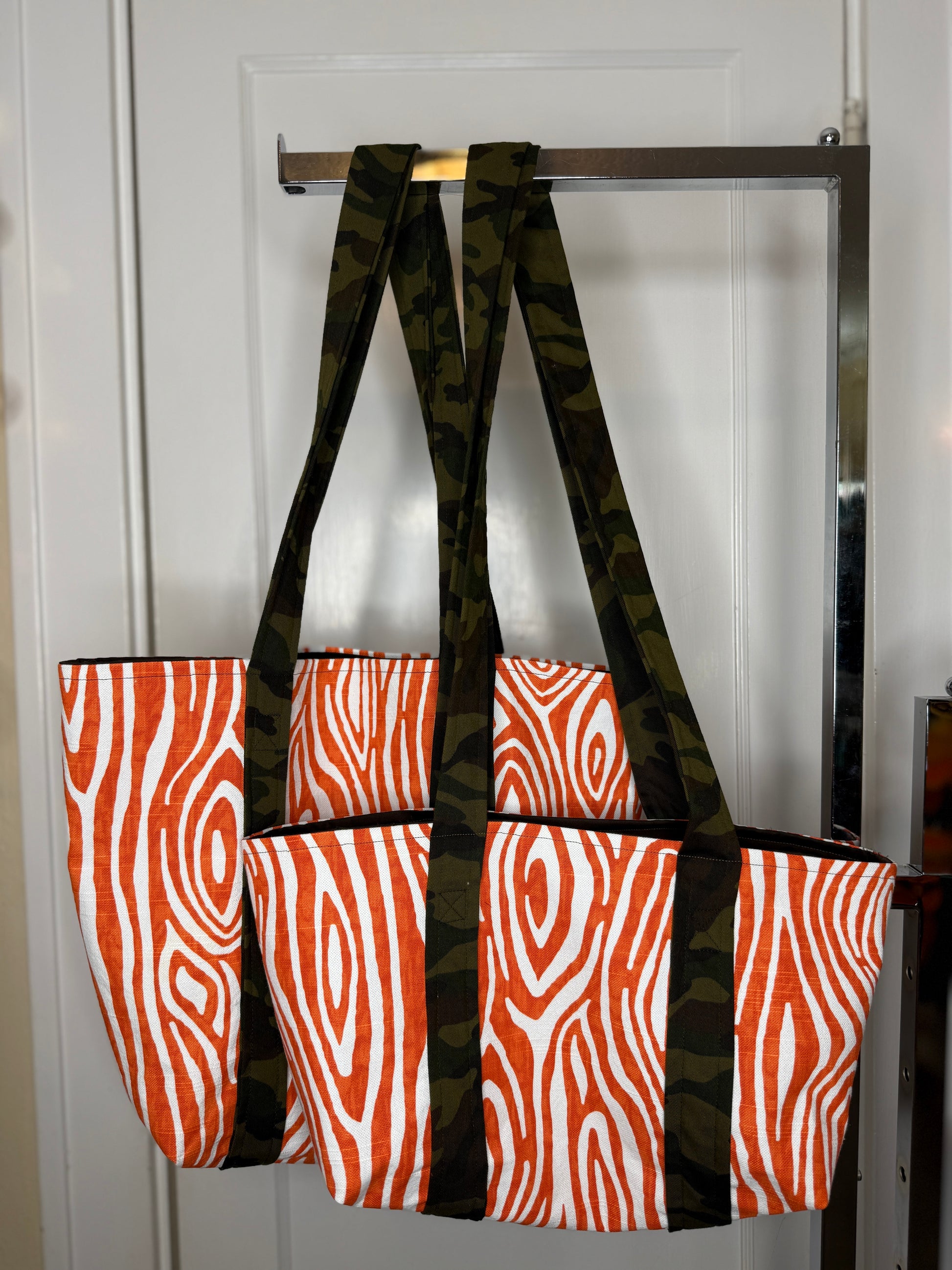 The mini tote next to the regular tote