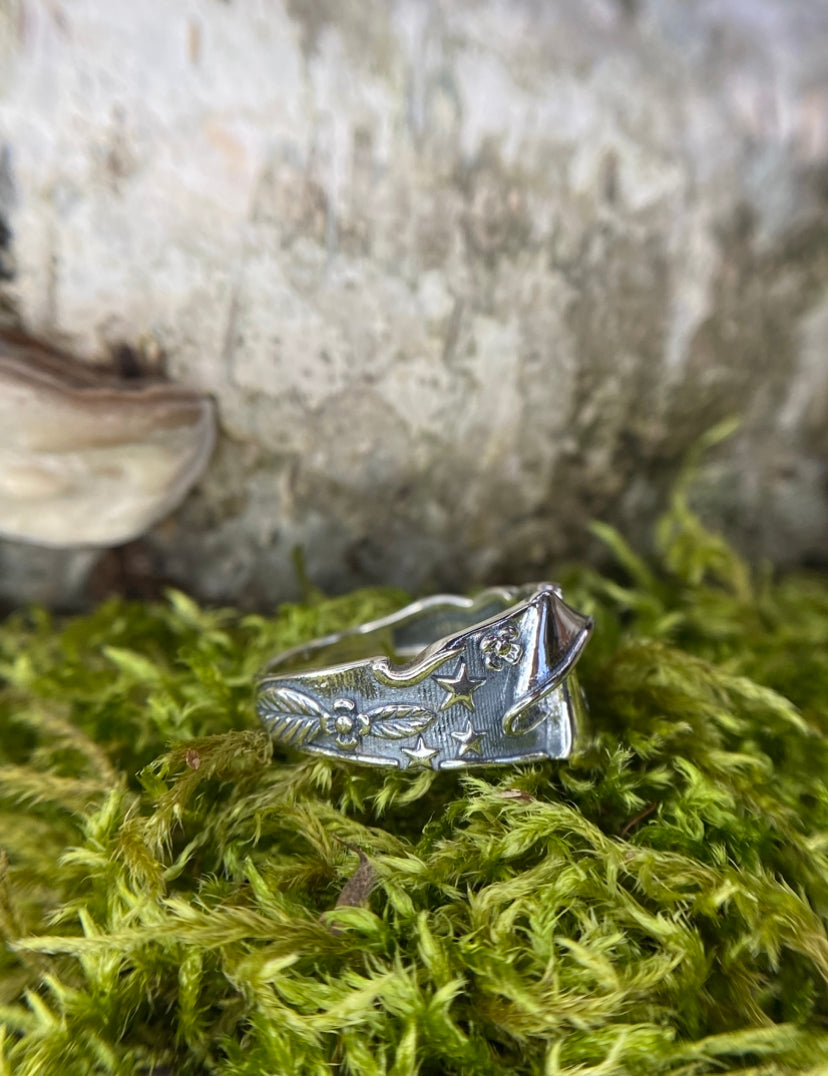 Sterling silver mushroom ring with stars and flowers.